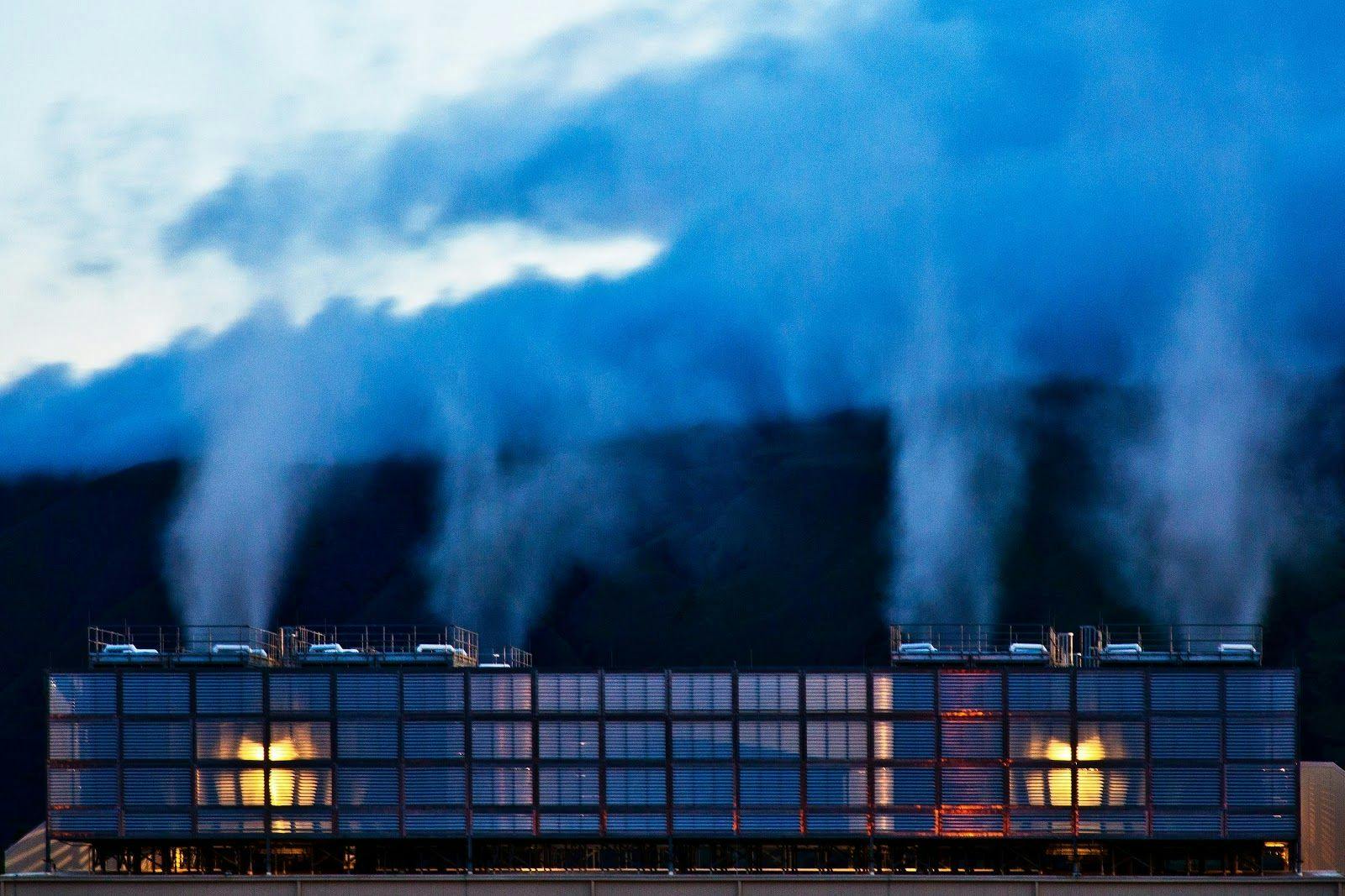 Steam rising from cooling towers at a Google Cloud facility in Dalles, Oregon