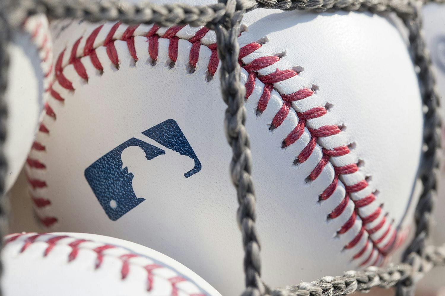 baseball with MLB logo on it